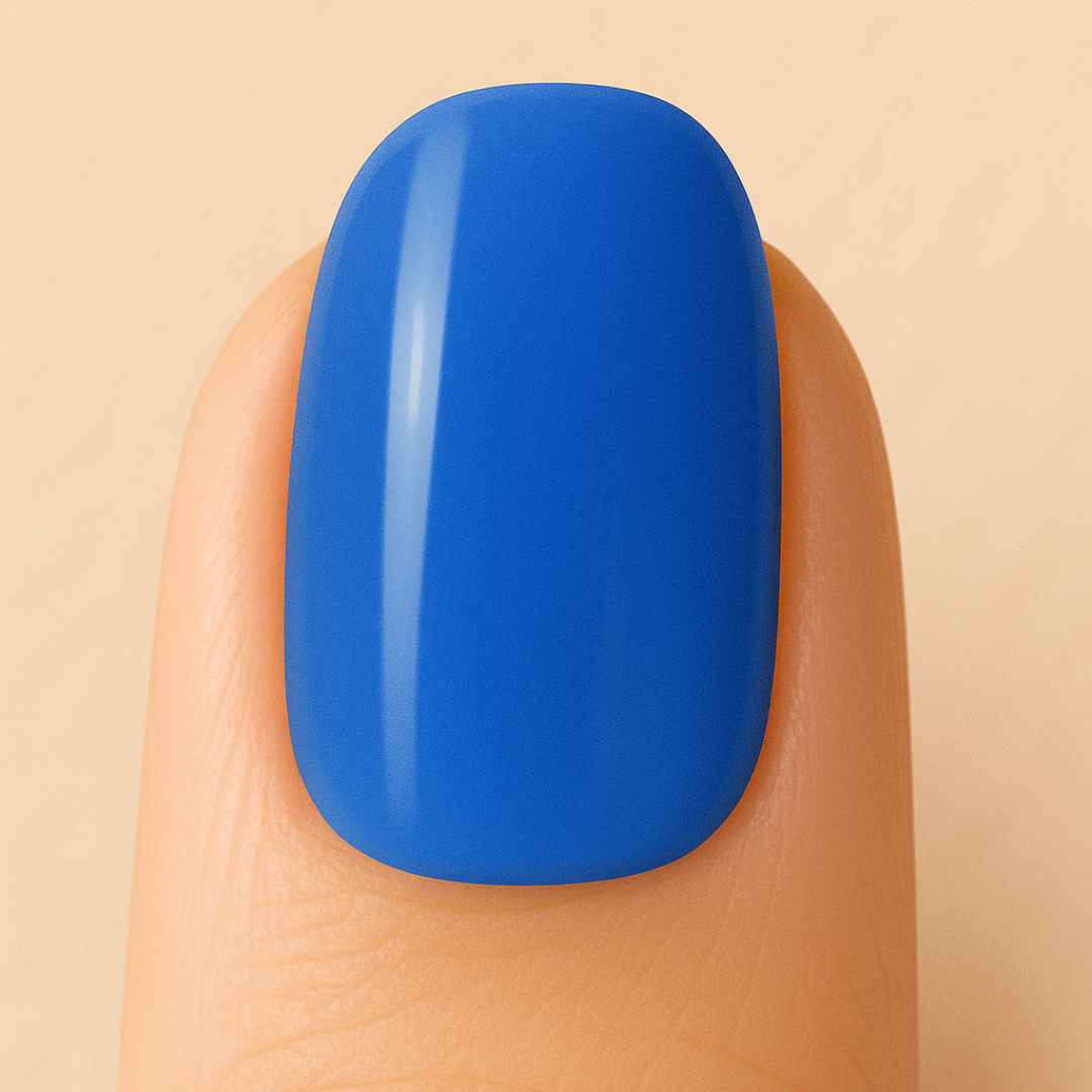 Blue gel polish on a finger against a beige background
