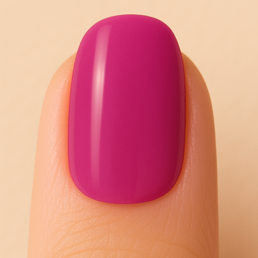Finger with a bright pink nail on a beige background