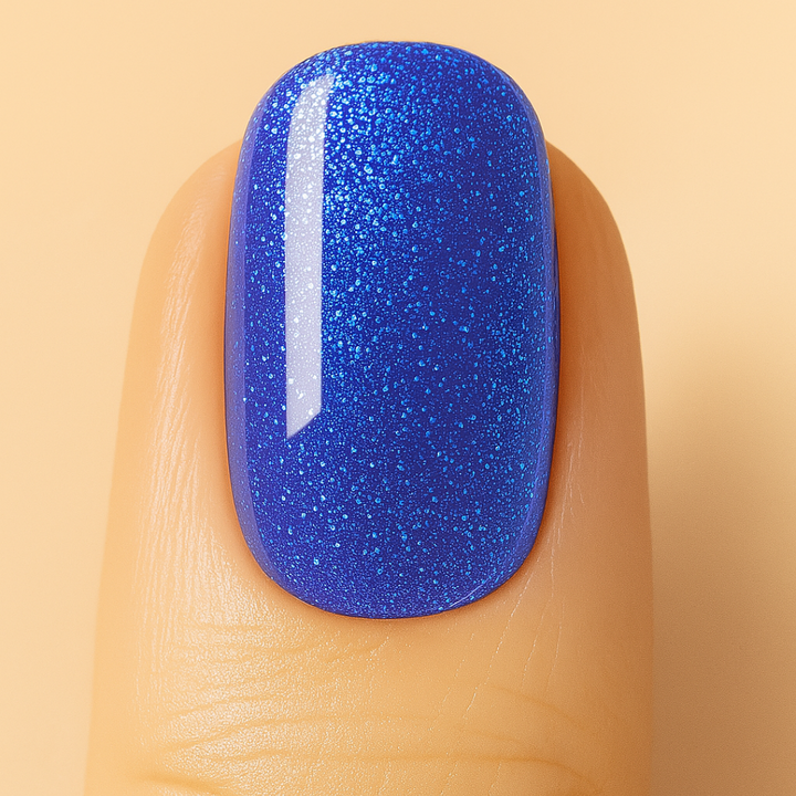 Blue and purple glittery gel polish on blank background.