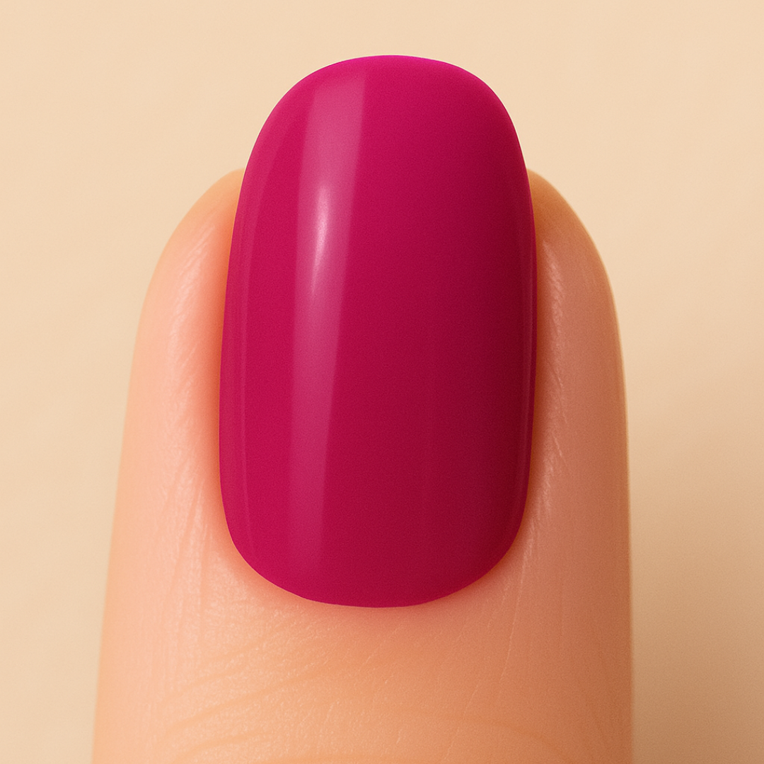 Finger with a bright pink nail on a beige background
