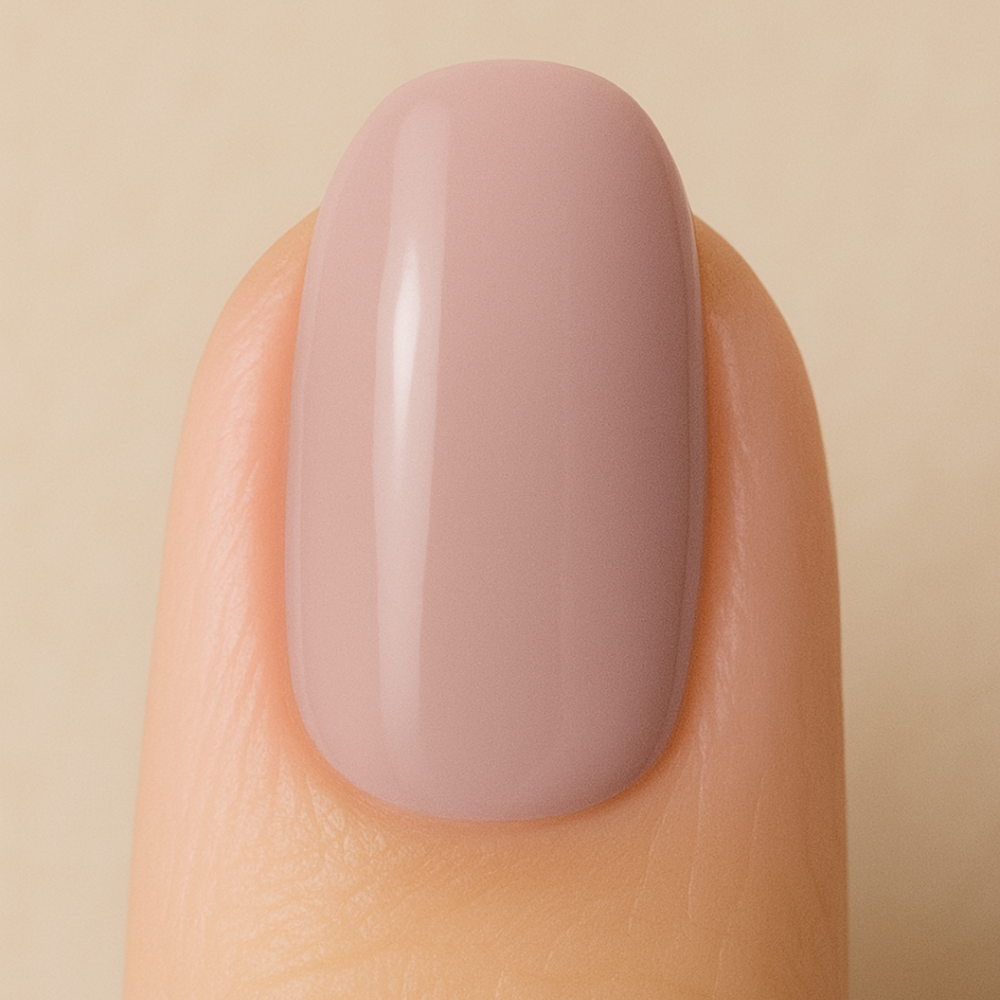 Nail with pinkish-purple gel polish on a beige background