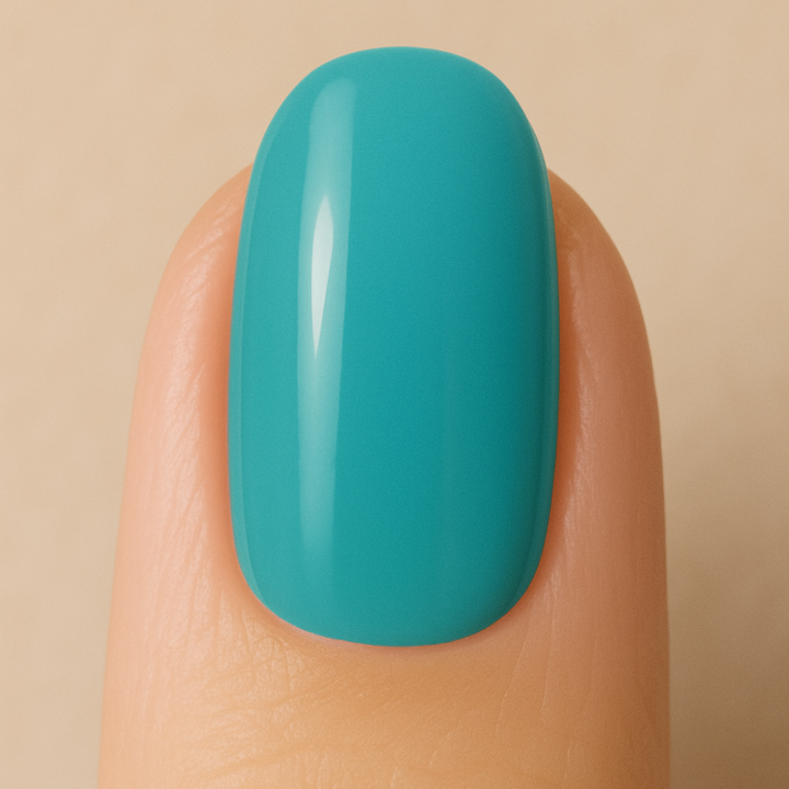 Bright-blue gel nail polish painted on a nail