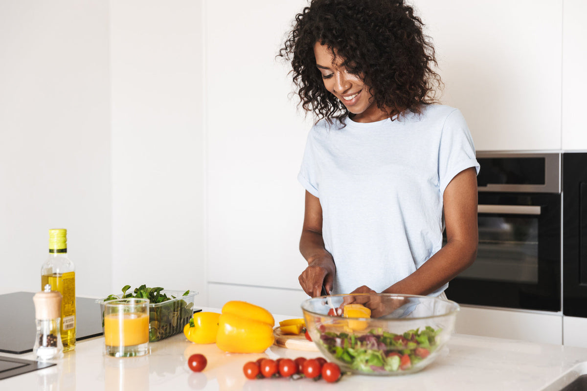 woman preparing vegetables in kitchen