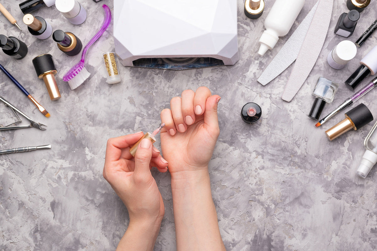 woman doing nails at home with essential tools