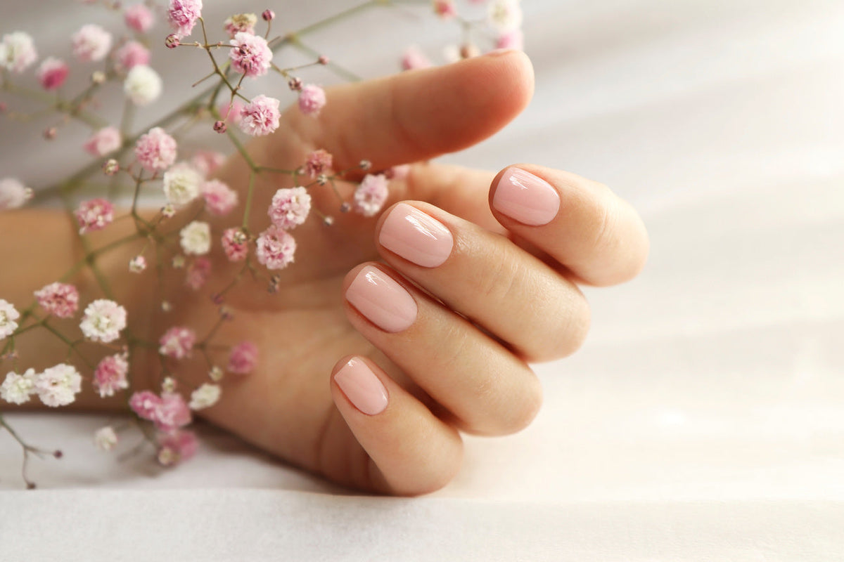 short manicured pink nails