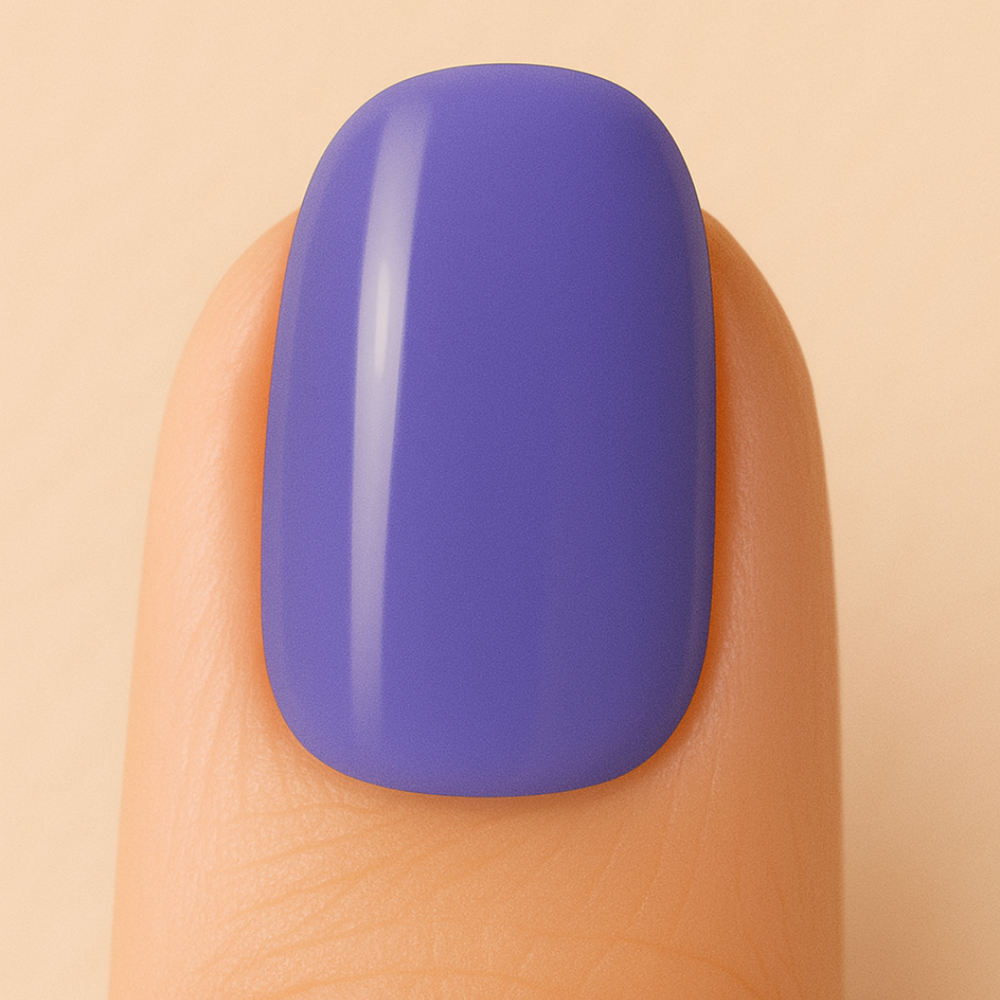 Purple gel polish on a finger against a beige background