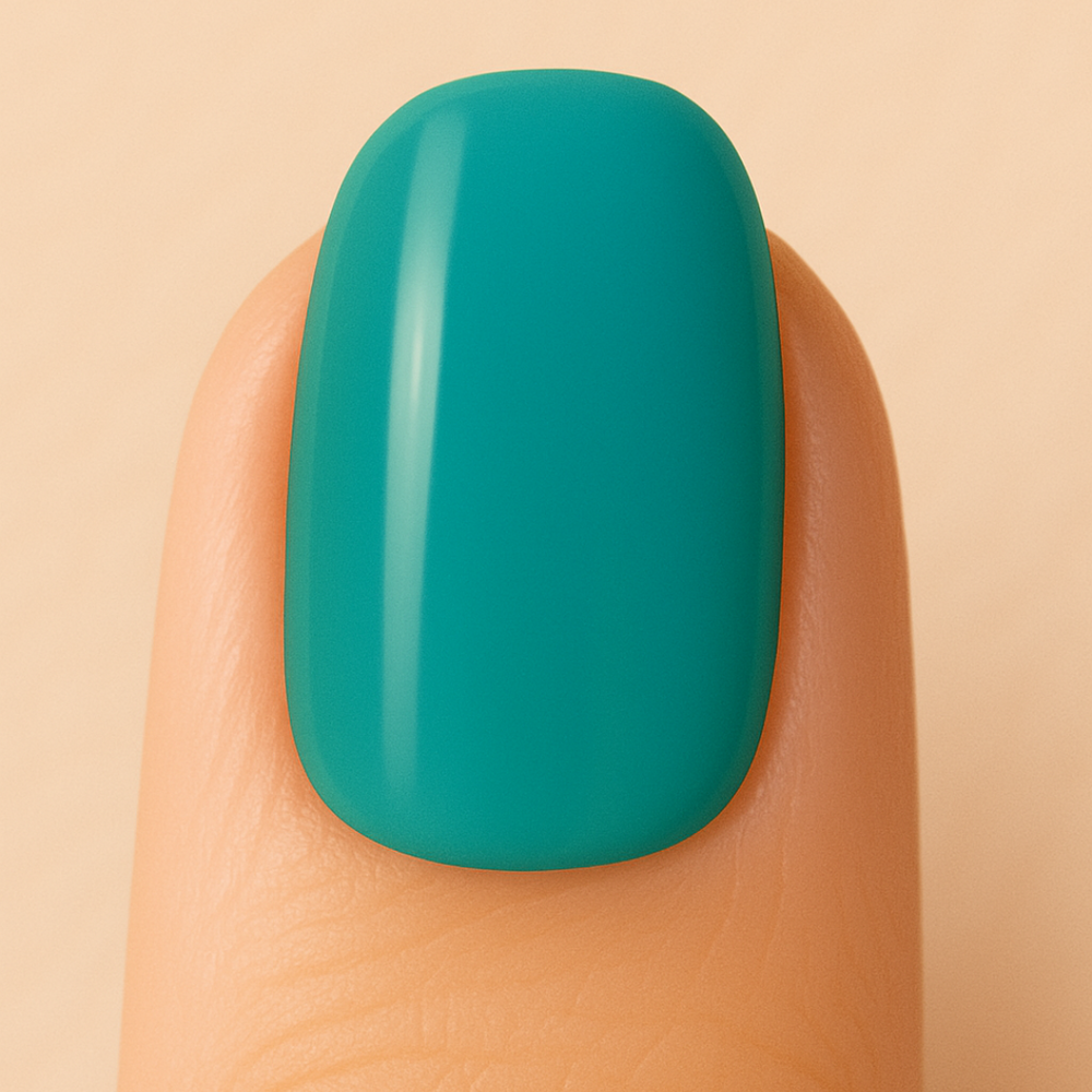 Teal nail polish on a finger against a beige background