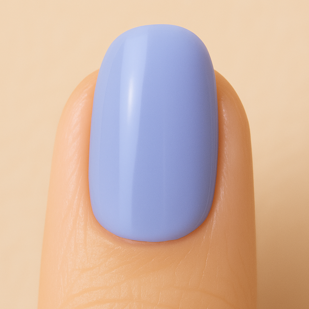 Nail with light blue gel polish on a beige background