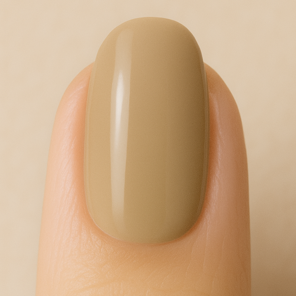 Nail with sand colour gel polish on a beige background
